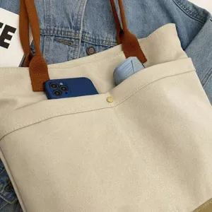 Canvas tote bag detail, large capacity canvas shoulder bag, casual commuting student book bag.