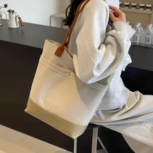 Large capacity canvas tote bag for daily commuting, versatile shoulder bag for students and work.