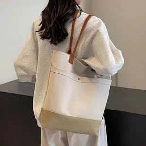 Large capacity canvas tote bag for daily commute, versatile student book shoulder bag.