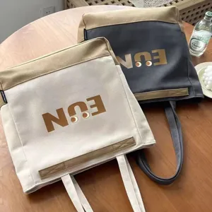 Canvas tote bag large capacity shoulder handbag casual commuting student book bag for daily use.