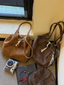 Brown suede tote bag for women, retro casual shoulder bag with plaid lining and large capacity.