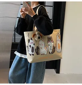 Korean casual large capacity canvas tote bag with cute cartoon cat prints and plush dog pendant.