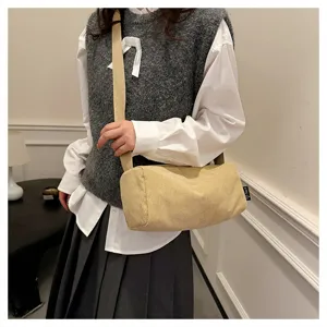 Casual corduroy shoulder bag for women, stylish cylinder crossbody pillow bag daily use.