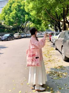 Pink canvas tote bag with letter print and cherry graphic, casual style for daily commuting.