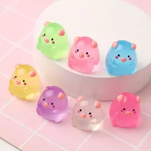 Mini translucent resin pig figurines for micro landscape decoration and DIY crafts detail.