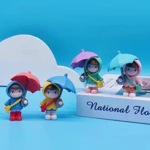 Cute rain-coated doll figurines holding umbrellas, resin micro landscape ornaments for decor.
