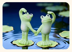 Detailed close-up of cute resin yoga frog figurines on lily pads for garden decor and desktop.