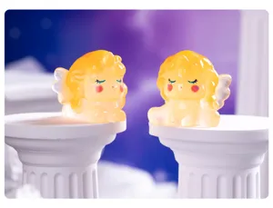 Detailed view of cute resin unicorn angel micro landscape ornaments on white pillar props.