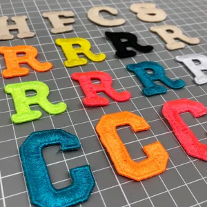 Colorful embroidered alphabet letter patches, fabric applique badges for DIY clothing and hats.