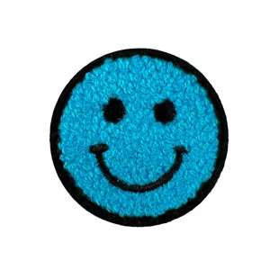 Blue fluffy smiley face embroidered patch, cute round towel patch for clothing decor.