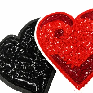 Heart shaped embroidered patch, red and black sew on fabric applique for clothing decor.