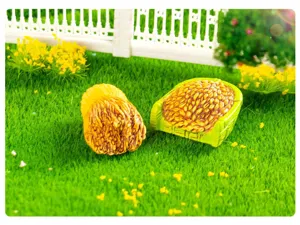 Close-up detail of miniature wheat sheaf and grain basket for DIY micro landscape gardening decor.