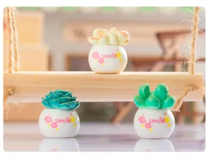 Mini succulent potted plant detail, cute resin micro landscape craft for desktop home decor.