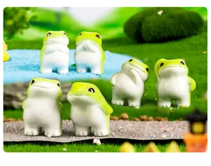 Close-up detail shot of cute resin frog figurines, perfect for miniature landscape and desktop decor.