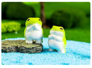 Detailed close-up of cute resin frog miniatures, ideal for micro landscape and desktop decor.