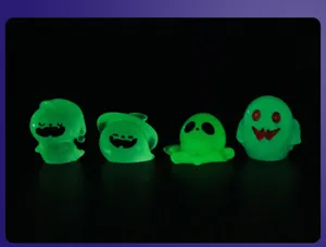 Detailed view of Halloween glowing resin ghost miniature figurines for micro landscape.