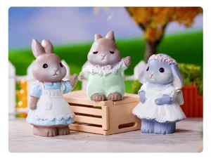 Detailed view of cute pastoral style resin rabbit figurines set for home desktop decoration.