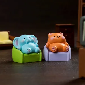 Cute miniature animal figurines sitting on tiny sofas, perfect for desktop decoration and micro landscapes.