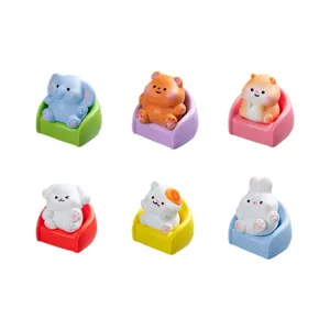 Cute mini animal resin figurine sitting on colorful sofa, perfect desktop micro landscape decor.