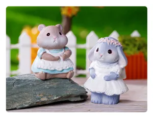 Close-up detail of cute pastoral animal resin figurines, perfect for garden and home decor.