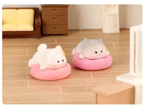 Mini cute sleeping animal figurines in miniature room scene detail for desk and car decor.