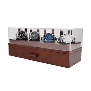 Detailed view of wooden watch storage box with clear acrylic cover and multiple display slots.
