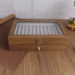 Scatola espositore per penne in legno vintage con coperchio in vetro, vista dettagliata.