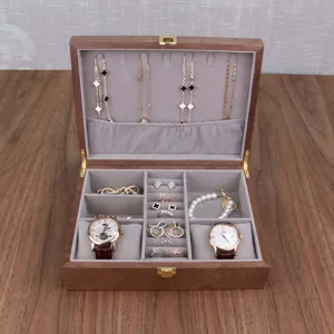 Walnut wood watch and jewelry storage box with compartments for rings, necklaces and watches.