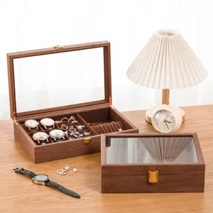 Detailed view of the wooden jewelry organizer box showing velvet interior and glass lid.