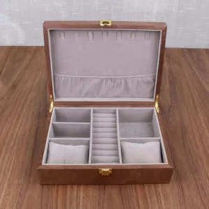 Wooden watch and jewelry storage box with velvet lining, multi-compartment ring organizer.