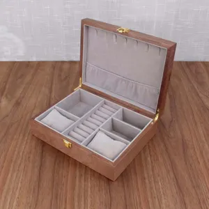 Wooden watch jewelry storage box with ring slots and velvet lining for organized accessory display.