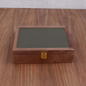 Black walnut wooden watch jewelry storage box detail view featuring glass top and gold metal lock.