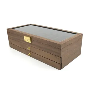 Caja de almacenamiento de madera de varias capas con tapa de cristal y cajones.