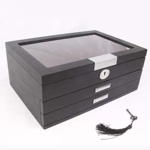 Wooden fountain pen display storage box detail showing glass lid and multi-layer drawers.