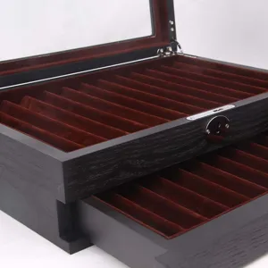 Wooden fountain pen storage box detail showcasing multi-slot velvet display tray and glass lid.