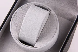 PU leather single watch winder interior detail showing soft gray velvet pillow and smooth texture.
