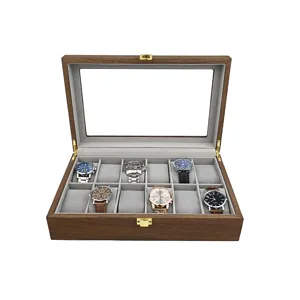 Boîte à montre en bois vintage avec couvercle en verre et dix fentes pour la présentation.
