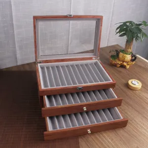 Vintage wooden fountain pen display box with glass lid and three velvet drawers for storage.