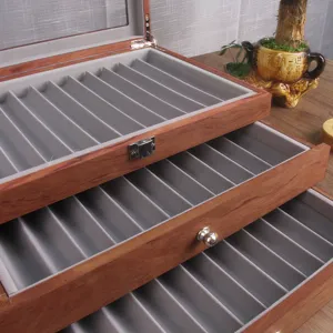 Multi-tier wooden fountain pen display box with grey velvet interior slots, vintage storage.