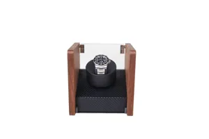 Single watch winder with wooden sides carbon fiber base and acrylic dust cover detail.
