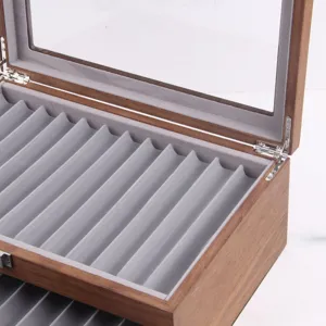 Wooden fountain pen display box with glass lid and grey velvet slotted tray detail.