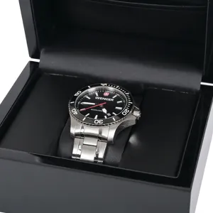 Premium black wooden watch box with high gloss finish and soft velvet pillow inside display.