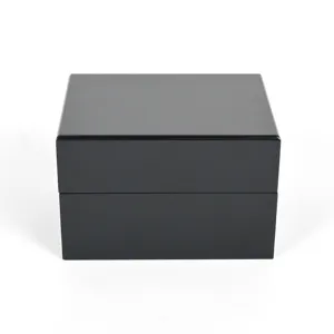 Detailed view of luxury black wooden watch box with glossy paint finish for elegant jewelry storage.