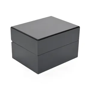 Close-up detail shot of a luxury black piano paint wooden watch and jewelry gift storage box.