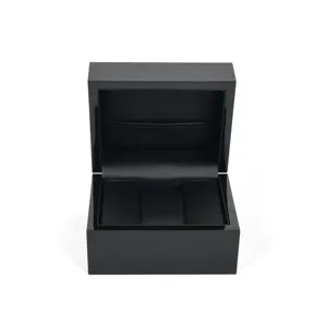 High-gloss black wooden watch box with soft interior cushion for luxury jewelry gift packaging.