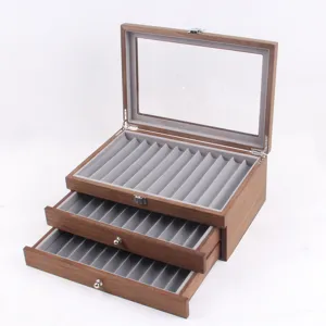 Wooden pen display box with glass top and three drawers for fountain pens and office stationery.