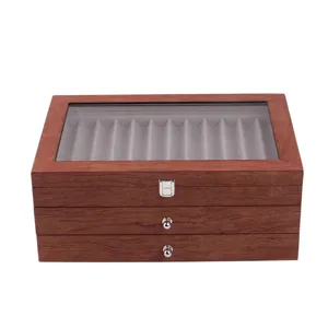 Vintage wooden fountain pen display box with glass lid and drawers for stationery storage.