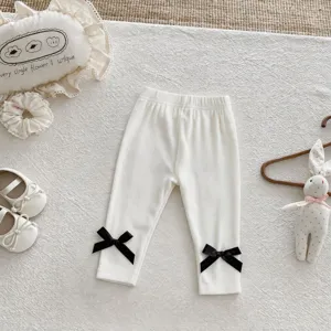Infant baby ribbed cotton leggings with cute black ankle bows, soft and elastic toddler pants.