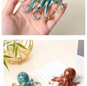 Resin octopus figurine detail view, featuring clear epoxy with crystal crushed stones and gold.