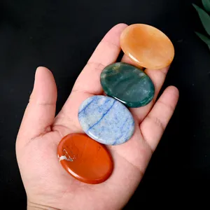 Natural crystal worry stones set, polished oval thumb massage palm stones for healing relaxation.